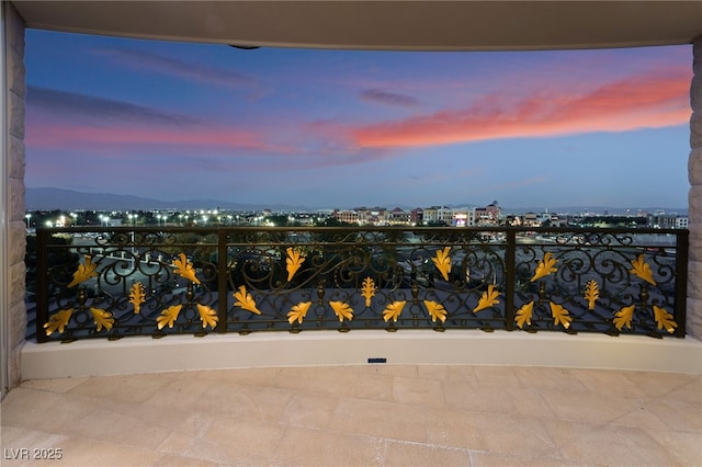 view of balcony at dusk