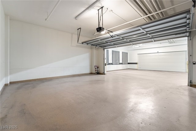 garage featuring baseboards and a garage door opener