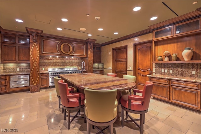 dining area featuring recessed lighting, stone tile floors, and crown molding