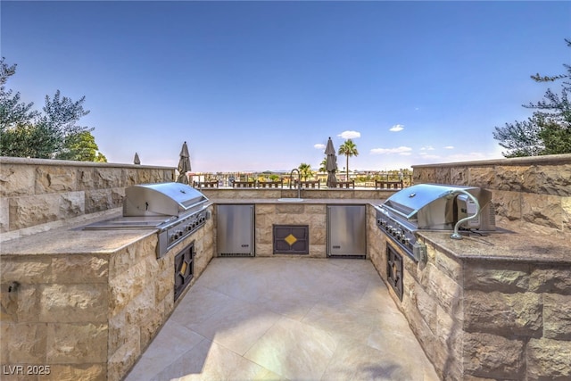 view of patio / terrace with a sink and area for grilling