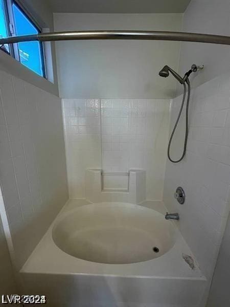 bathroom featuring bathtub / shower combination