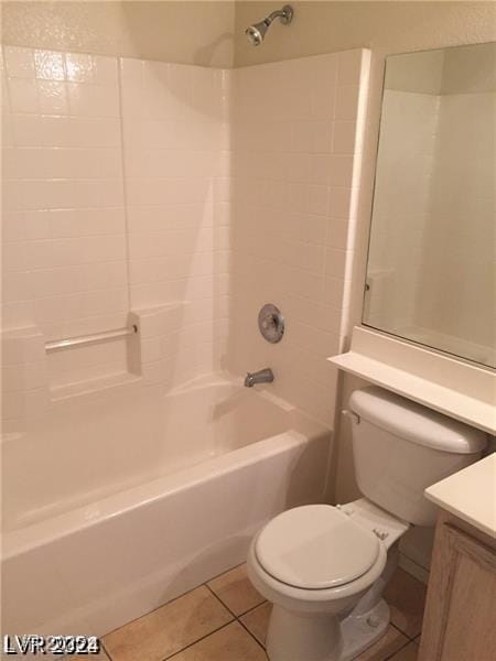 bathroom featuring bathtub / shower combination, toilet, tile patterned flooring, and vanity
