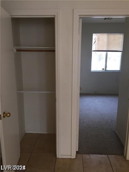 closet featuring visible vents
