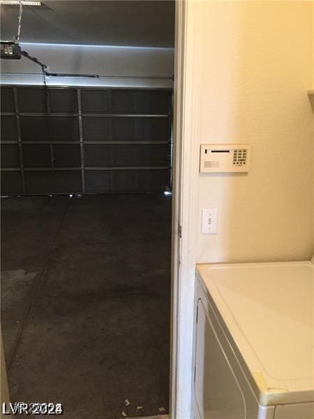 clothes washing area with washing machine and dryer