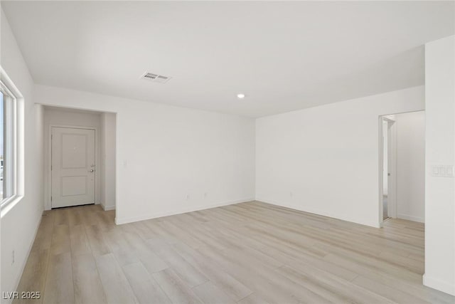 2618 Lily Point St, Las Vegas, NV 89156 - spare room featuring light wood-type flooring, healthy amount of natural light, and baseboards