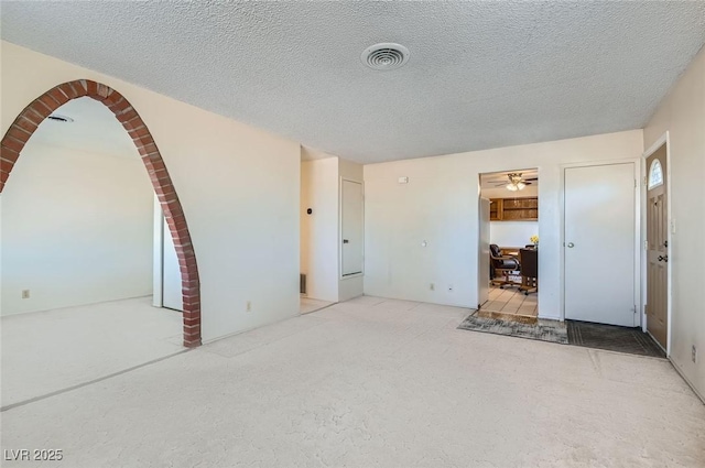 interior space featuring visible vents and a textured ceiling