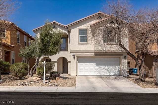 mediterranean / spanish-style home with a tiled roof, a garage, concrete driveway, and stucco siding