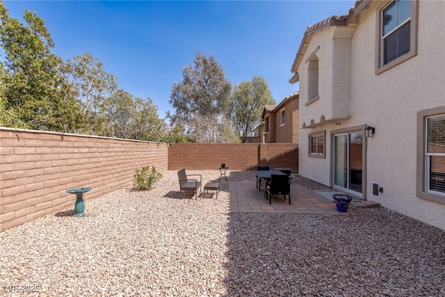view of yard with a patio and a fenced backyard