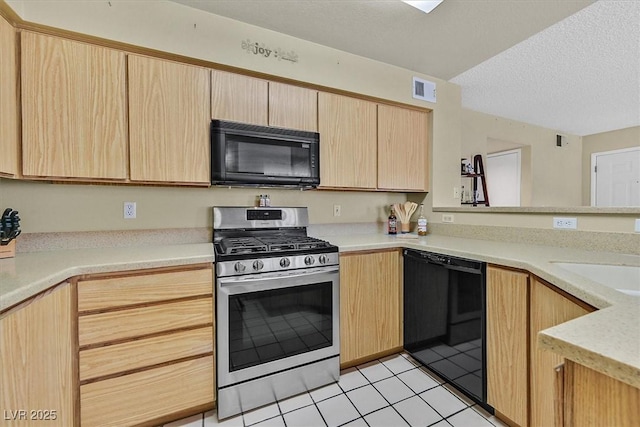 7901 Idledale Ct Unit 102, Las Vegas, NV 89145 - kitchen featuring black appliances, light brown cabinetry, light countertops, a textured ceiling, and light tile patterned floors