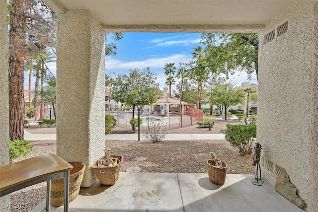 7901 Idledale Ct Unit 102, Las Vegas, NV 89145 - view of patio / terrace featuring fence