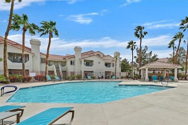 7901 Idledale Ct Unit 102, Las Vegas, NV 89145 - community pool featuring fence, a gazebo, a patio area, and a residential view
