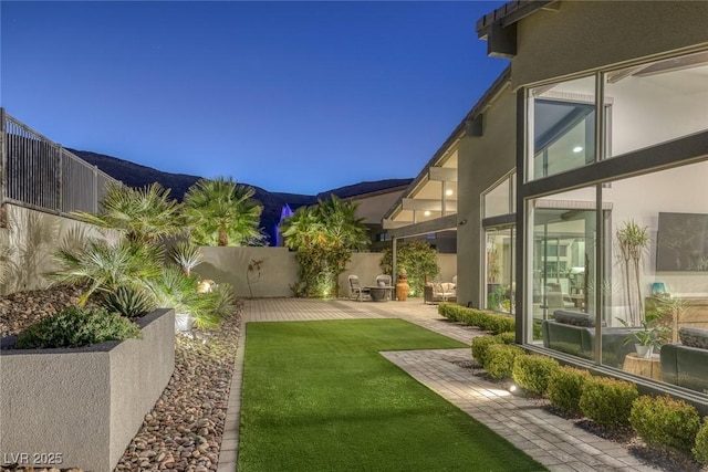 10271 Meridian Hill Ave, Las Vegas, NV 89135 - view of yard with a fenced backyard, a patio, and a mountain view