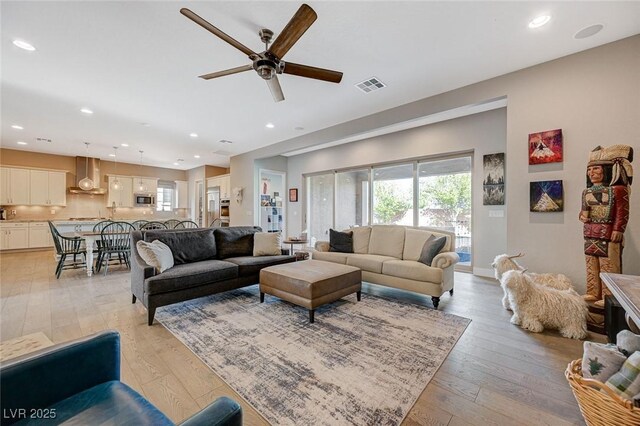 10840 Rosin Jaw St, Las Vegas, NV 89183 - living area with light wood finished floors, ceiling fan, visible vents, and recessed lighting