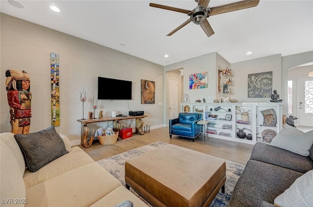 10840 Rosin Jaw St, Las Vegas, NV 89183 - living room with recessed lighting, a ceiling fan, arched walkways, and wood finished floors