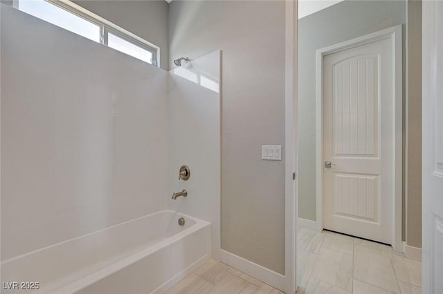 10840 Rosin Jaw St, Las Vegas, NV 89183 - bathroom with marble finish floor, shower / bathing tub combination, and baseboards