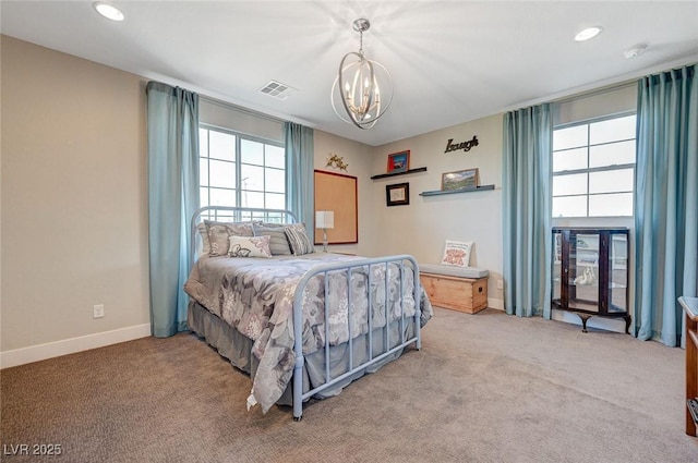 10840 Rosin Jaw St, Las Vegas, NV 89183 - bedroom with baseboards, a chandelier, recessed lighting, visible vents, and light colored carpet