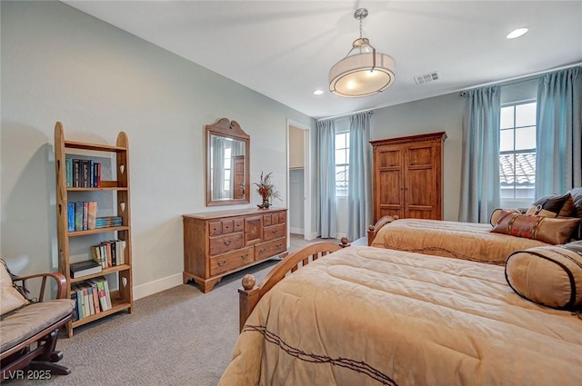 10840 Rosin Jaw St, Las Vegas, NV 89183 - bedroom with visible vents, baseboards, multiple windows, and light carpet