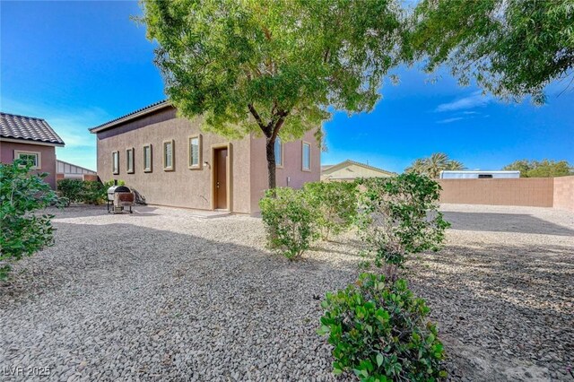 10840 Rosin Jaw St, Las Vegas, NV 89183 - view of yard featuring a patio and a fenced backyard