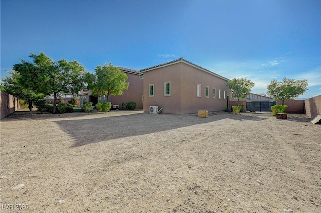 10840 Rosin Jaw St, Las Vegas, NV 89183 - rear view of property featuring a fenced backyard and stucco siding