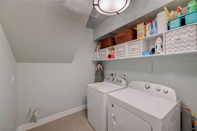 10840 Rosin Jaw St, Las Vegas, NV 89183 - laundry area with laundry area, light tile patterned floors, visible vents, washer and dryer, and baseboards