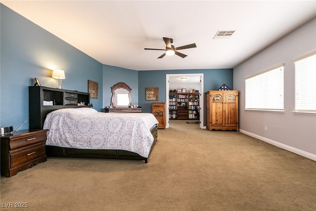 7416 Redhead Dr, North Las Vegas, NV 89084 - bedroom with light colored carpet, a ceiling fan, and baseboards