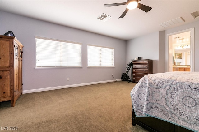 7416 Redhead Dr, North Las Vegas, NV 89084 - bedroom with light colored carpet, baseboards, ensuite bath, and ceiling fan