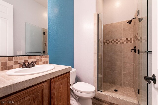 7416 Redhead Dr, North Las Vegas, NV 89084 - full bathroom featuring a shower stall, vanity, and decorative backsplash
