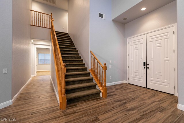 7416 Redhead Dr, North Las Vegas, NV 89084 - entrance foyer featuring stairs, wood finished floors, and a towering ceiling