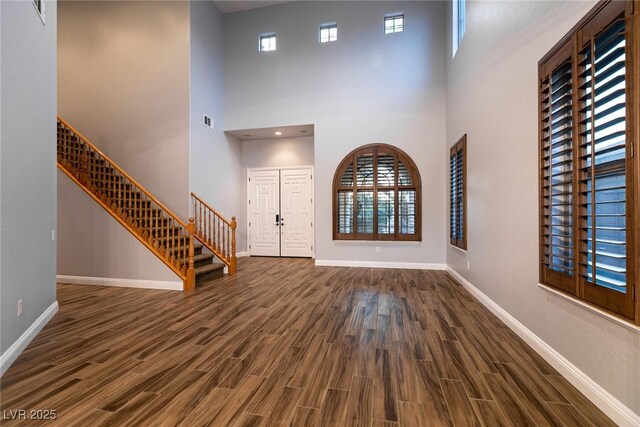 7416 Redhead Dr, North Las Vegas, NV 89084 - foyer featuring stairs, dark wood-style floors, and a towering ceiling