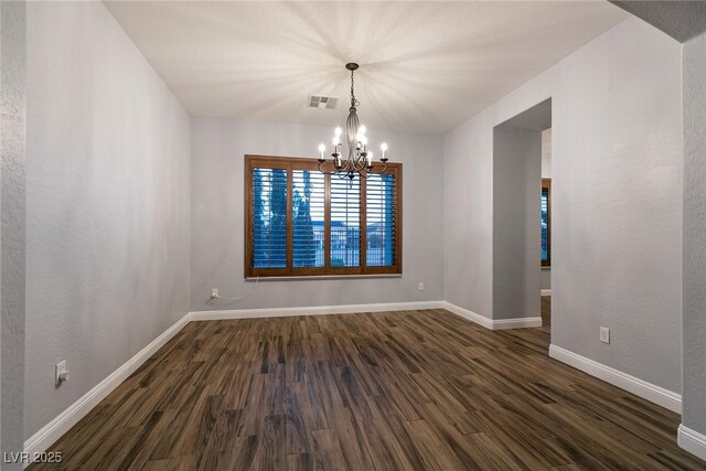 7416 Redhead Dr, North Las Vegas, NV 89084 - unfurnished room featuring a chandelier and dark wood finished floors