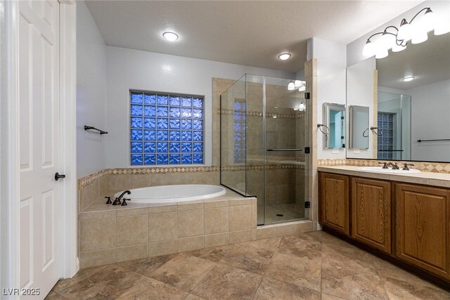 7416 Redhead Dr, North Las Vegas, NV 89084 - full bath with vanity, a bath, a stall shower, and stone finish floors