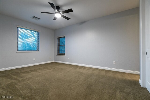 7416 Redhead Dr, North Las Vegas, NV 89084 - empty room featuring dark carpet and ceiling fan