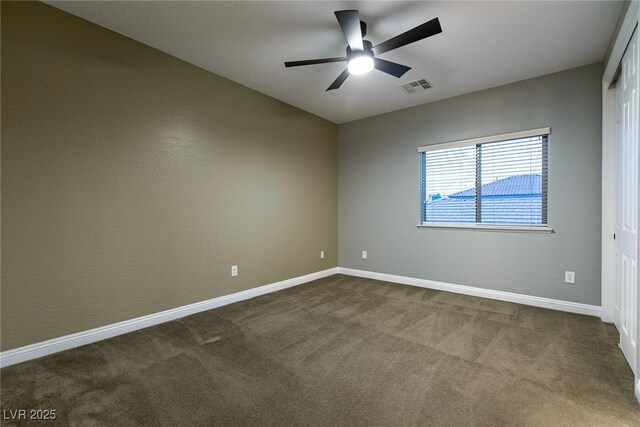7416 Redhead Dr, North Las Vegas, NV 89084 - spare room with a ceiling fan and dark colored carpet