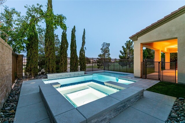 7416 Redhead Dr, North Las Vegas, NV 89084 - view of swimming pool featuring an in-ground hot tub and a fenced backyard