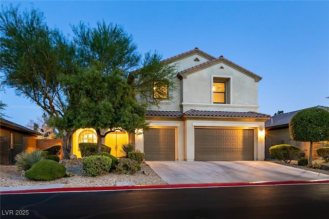 7416 Redhead Dr, North Las Vegas, NV 89084 - mediterranean / spanish-style house with stucco siding, an attached garage, driveway, and a tiled roof