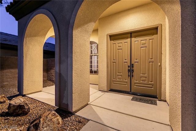 7416 Redhead Dr, North Las Vegas, NV 89084 - view of exterior entry with stucco siding and french doors