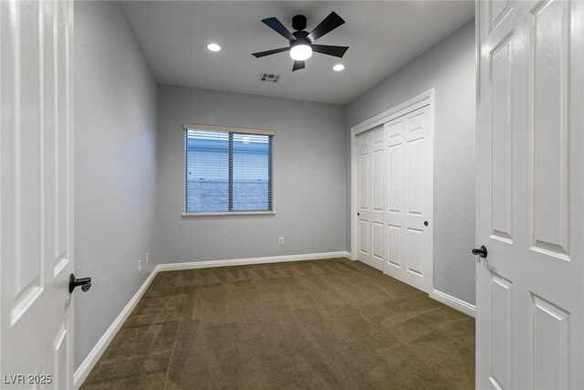 7416 Redhead Dr, North Las Vegas, NV 89084 - unfurnished bedroom with dark colored carpet, recessed lighting, a closet, and ceiling fan