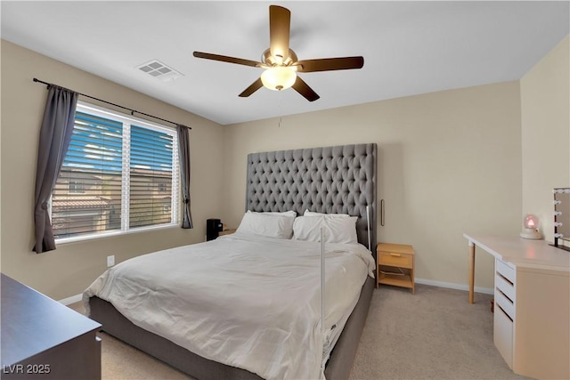 bedroom with baseboards, ceiling fan, visible vents, and light carpet