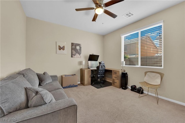 office with carpet floors, baseboards, visible vents, and ceiling fan