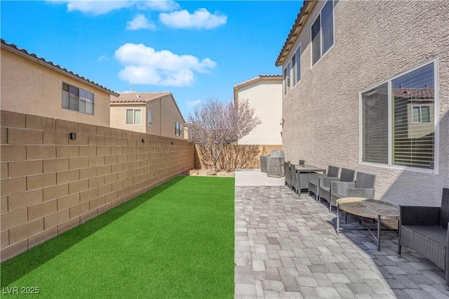 view of yard with a fenced backyard and a patio area