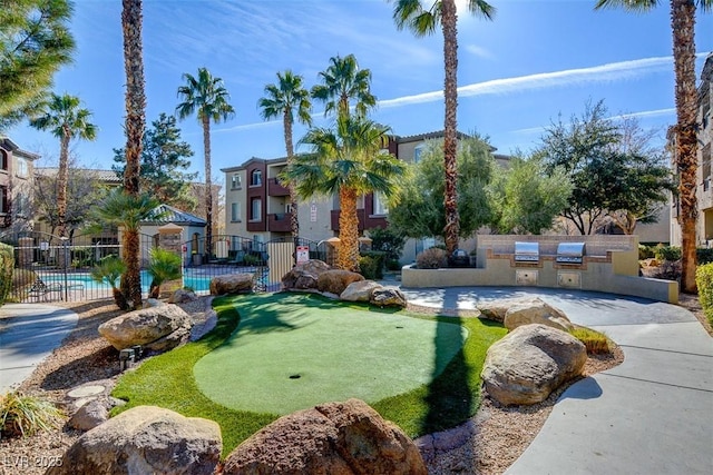 4400 S Jones Blvd Unit 2103, Las Vegas, NV 89103 - view of property's community featuring an outdoor kitchen and fence