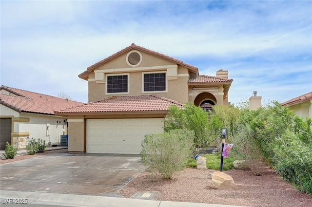 4808 Fiesta Lakes St, Las Vegas, NV 89130 - mediterranean / spanish-style house with concrete driveway, stucco siding, a tiled roof, cooling unit, and an attached garage