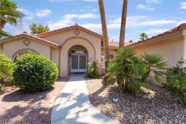 5217 Cold River Ave, Las Vegas, NV 89130 - entrance to property with stucco siding and a tiled roof