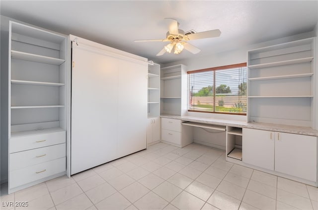 5217 Cold River Ave, Las Vegas, NV 89130 - unfurnished office with a ceiling fan, built in study area, and light tile patterned flooring