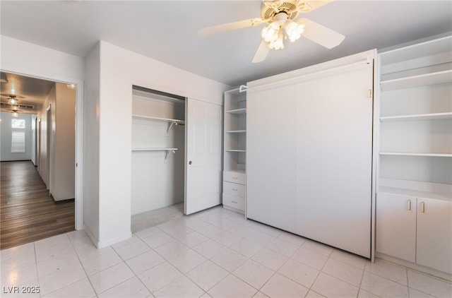 5217 Cold River Ave, Las Vegas, NV 89130 - unfurnished bedroom with a closet, ceiling fan, and light tile patterned flooring