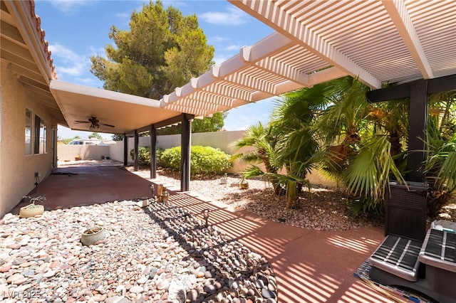 5217 Cold River Ave, Las Vegas, NV 89130 - fenced backyard with ceiling fan, a patio area, and a pergola