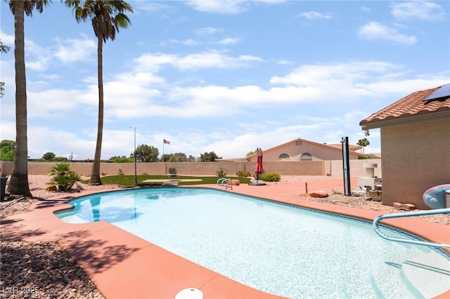 5217 Cold River Ave, Las Vegas, NV 89130 - view of swimming pool featuring a diving board and a patio area