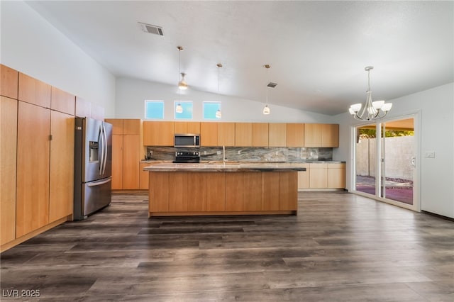 5217 Cold River Ave, Las Vegas, NV 89130 - kitchen with stainless steel appliances, an island with sink, tasteful backsplash, a chandelier, and modern cabinets