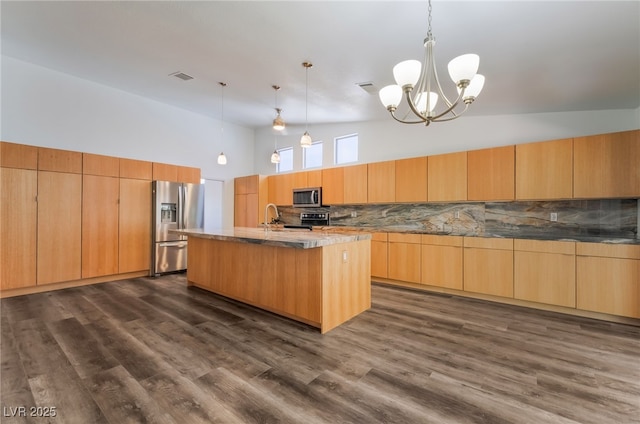 5217 Cold River Ave, Las Vegas, NV 89130 - kitchen featuring stainless steel appliances, high vaulted ceiling, backsplash, a kitchen island with sink, and a chandelier