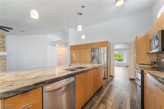 5217 Cold River Ave, Las Vegas, NV 89130 - kitchen featuring stainless steel appliances, light stone counters, dark wood-style flooring, pendant lighting, and modern cabinets